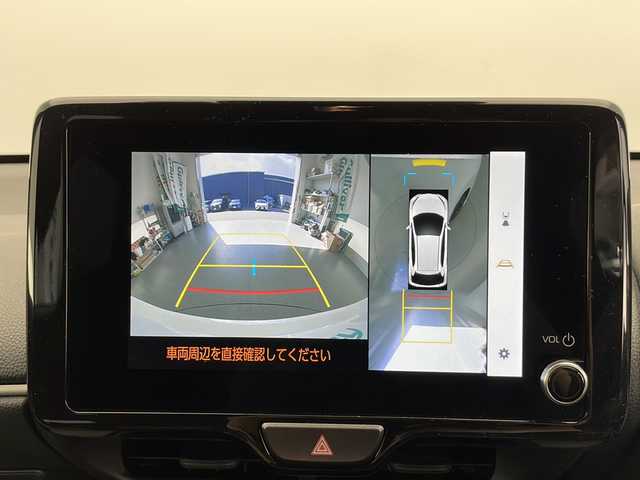 トヨタ ヤリス ハイブリッド Z 長野県 2024(令6)年 0.5万km スーパーホワイトⅡ 純正メモリナビ/Bluetooth／AM／FM/全方位カメラ/ETC/横滑り防止装置/衝突被害軽減システム/レーンキープアシスト/自動駐車システム/社外15インチAW装着/純正フロアマット/ドアバイザー/ヘッドライトレベライザー/クルーズコントロール/ハーフレザー/前席シートヒーター/前後コーナーセンサー/電格ミラー/LEDヘッドライト/スマートキー/スペアキー1本