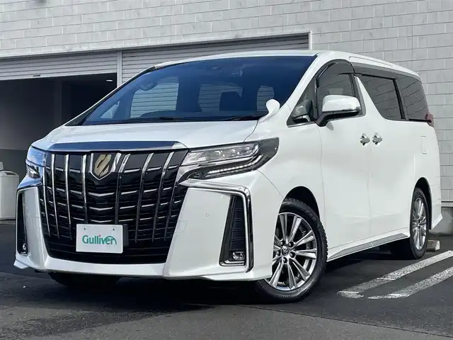 トヨタ アルファード S タイプゴールドⅡ 道央・札幌 2021(令3)年 5万km ホワイトパールクリスタルシャイン ・4WD/・寒冷地仕様/・純正ディスプレイオーディオ/（フルセグ/AM/FM/CD/DVD/BT）/・純正フリップダウンモニター/・純正エンジンスターター/・社外ドライブレコーダー前後/・純正ビルトインETC/・バックモニター/・デジタルインナーミラー/・両側パワースライドドア/・衝突軽減ブレーキ/・クルーズコントロール（追従機能付）/・コーナーセンサー/・レーンキープアシスト/・ハーフレザーシート/・オートエアコン/・純正　18インチAW（スタッドレス）/・電動バックドア/・後席オットマン/・ドアバイザー/・ステアリングスイッチ/・オートブレーキホールド/・電動パーキングブレーキ/・LEDヘッドライト/・LEDフォグランプ/・リアフォグランプ/・ワイパーデアイサー/・オートライト/・オートハイビーム/・SOSコール/・盗難防止装置/・ABS/・横滑り防止装置/・スマートキー/・プッシュスタート/・スペアキー/・社外フロアマット