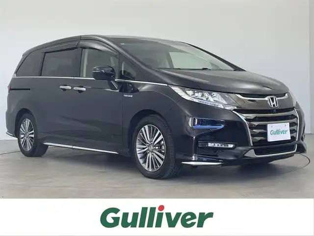 ホンダ オデッセイ ハイブリッド アブソルート・EXホンダセンジング 埼玉県 2017(平29)年 4.3万km プレミアムヴィーナスブラックP ホンダセンシング/　CMBS（衝突軽減ブレーキ）/　ACC（アダプティブクルーズコントロール）/　LKAS（車線維持支援システム）/純正9インチメモリナビ　（VXM-185VFNi）/　DTV CD DVD BT USB HDMI iPod/両側パワースライドドア/全方位カメラ/純正フリップダウンモニター/後席スモーク/ウォークスルー/横滑り防止装置/ビルトインETC2.0/エンジンスタートボタン/スマートキー/スペアキー/オートライト/純正LEDヘッドライト＆フォグランプ/純正アルミホイール