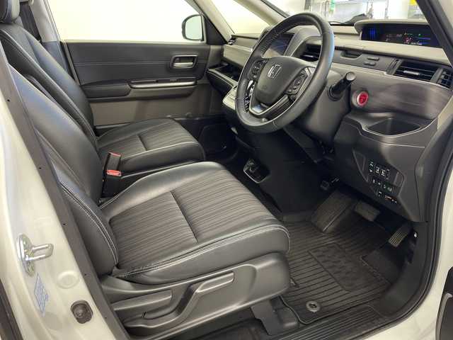 ホンダ フリード ハイブリット EX 岐阜県 2018(平30)年 5.6万km ホワイトオーキッドパール 純正9インチメモリナビ（VXM-197VFNi）/フルセグ/BT/DVD/バックカメラ/ホンダセンシング/・衝突軽減ブレーキ/・アダプティブクルーズコントロール/・車線維持支援システム/・路外逸脱抑制機能/・先行車発進お知らせ機能/・誤発進抑制機能/・後方誤発進抑制機能/ビルトインETC/社外ドライブ/ハーフレザーシート/前席シートヒーター/本革ステアリング/ステアリングスイッチ/LEDオートライト/パーキングセンサー/純正フロアマット/GPSレーダー探知機/サイドバイザー/純正15インチAW/プッシュスタート/サンシェード