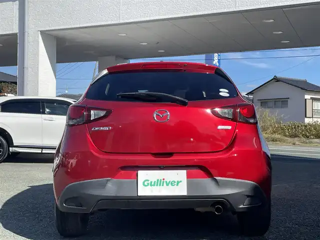 マツダ デミオ 13S 熊本県 2015(平27)年 9.5万km ソウルレッドプレミアムメタリック 純正ナビ/【ワンセグテレビ/Bluetooth/USB/AM/FM】/バックカメラ/ステアリングスイッチ/アイドリングストップ/横滑り防止/MTモード/プッシュスタート/HID/ヘッドライトレベライザー/スマートキー/スペアキー/ドアバイザー/取扱説明書