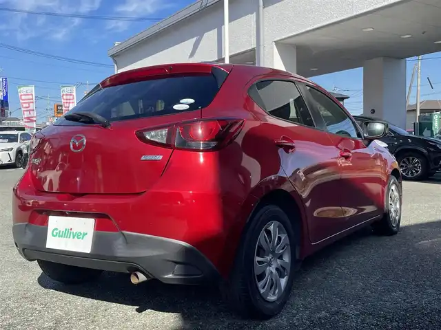 マツダ デミオ 13S 熊本県 2015(平27)年 9.5万km ソウルレッドプレミアムメタリック 純正ナビ/【ワンセグテレビ/Bluetooth/USB/AM/FM】/バックカメラ/ステアリングスイッチ/アイドリングストップ/横滑り防止/MTモード/プッシュスタート/HID/ヘッドライトレベライザー/スマートキー/スペアキー/ドアバイザー/取扱説明書