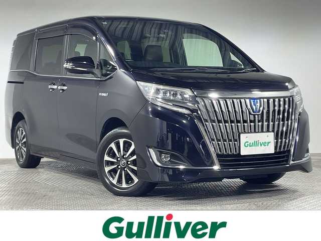 トヨタ エスクァイア ハイブリッド Gi プレミアムパッケージ 神奈川県 2017(平29)年 6.2万km スパークリングブラックパールクリスタルシャイン トヨタセーフティセンス/プリクラッシュセーフティー/レーンディパーチャーアラート/オートマチックハイビーム/10型ナビ/Bluetooth/フルセグ/CD DVD　SD/USB/バックカメラ/フリップダウンモニター/両側パワースライドドア/TRC/AC100V/ETC/ハーフレザー/シートヒーター/革ステアリング/ステアリングスイッチ/オートライト/ステアリングヒーター/クルーズコントロール/スマートキー/スペアキー/プッシュスタート/シートリフター/自動防眩ミラー/電動格納ミラー/ウィンカーミラー/LEDヘッドライト/フォグランプ/純正フロアマット/純正アルミホイール/純正バイザー