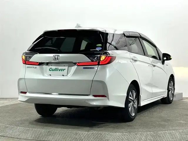 ホンダ シャトル ハイブリッド ホンダセンシング 大阪府 2021(令3)年 3.5万km プラチナホワイトパール 社外ナビ(地デジ/DVD再生/Bluetooth) バックカメラ ETC 衝突軽減 レーダークルコン レーンアシスト オートライト オートエアコン スマートキー プッシュスタート 横滑り防止