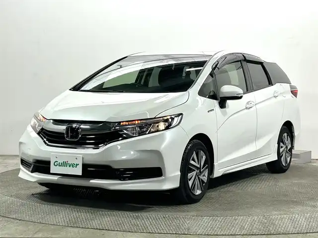 ホンダ シャトル ハイブリッド ホンダセンシング 大阪府 2021(令3)年 3.5万km プラチナホワイトパール 社外ナビ(地デジ/DVD再生/Bluetooth) バックカメラ ETC 衝突軽減 レーダークルコン レーンアシスト オートライト オートエアコン スマートキー プッシュスタート 横滑り防止
