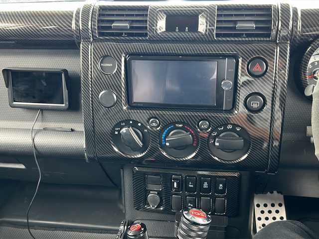 トヨタ ＦＪクルーザー 富山県 2014(平26)年 2.4万km ホワイト 4WD/純正SDナビ（NSZT-W62G）/フルセグ/Bluetooth/バックカメラ/サイドカメラ/ドライブレコーダー/ETC/クリアランスソナー/クルーズコントロール/リフトアップ/BFグッドリッチ オールテレーン（275/55/R20）/JAOSマッドフラップ/オーバーフェンダーキット/背面タイヤ/社外20インチアルミホイール/社外マフラー