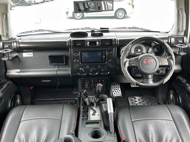トヨタ ＦＪクルーザー 富山県 2014(平26)年 2.4万km ホワイト 4WD/純正SDナビ（NSZT-W62G）/フルセグ/Bluetooth/バックカメラ/サイドカメラ/ドライブレコーダー/ETC/クリアランスソナー/クルーズコントロール/リフトアップ/BFグッドリッチ オールテレーン（275/55/R20）/JAOSマッドフラップ/オーバーフェンダーキット/背面タイヤ/社外20インチアルミホイール/社外マフラー