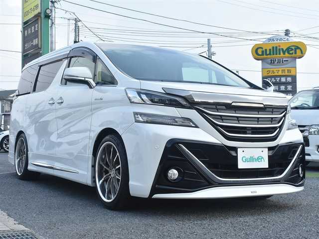 トヨタ ヴェルファイア ハイブリット X 神奈川県 2015(平27)年 5.2万km ホワイトパールクリスタルシャイン ワンオーナー/社外メモリナビ/フルセグテレビ/両側パワースライドドア/モデリスタエアロ/社外２０インチAW/社外足廻り/ETC/LEDヘッドライト/保証書/スペアスマートキー