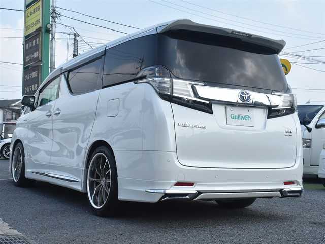 トヨタ ヴェルファイア ハイブリット X 神奈川県 2015(平27)年 5.2万km ホワイトパールクリスタルシャイン ワンオーナー/社外メモリナビ/フルセグテレビ/両側パワースライドドア/モデリスタエアロ/社外２０インチAW/社外足廻り/ETC/LEDヘッドライト/保証書/スペアスマートキー