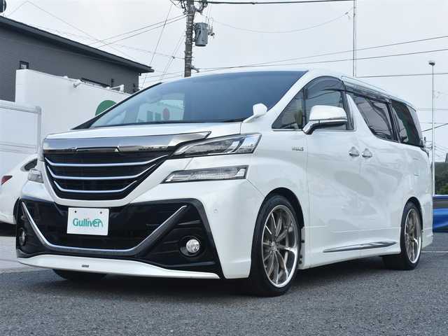 トヨタ ヴェルファイア ハイブリット X 神奈川県 2015(平27)年 5.2万km ホワイトパールクリスタルシャイン ワンオーナー/社外メモリナビ/フルセグテレビ/両側パワースライドドア/モデリスタエアロ/社外２０インチAW/社外足廻り/ETC/LEDヘッドライト/保証書/スペアスマートキー