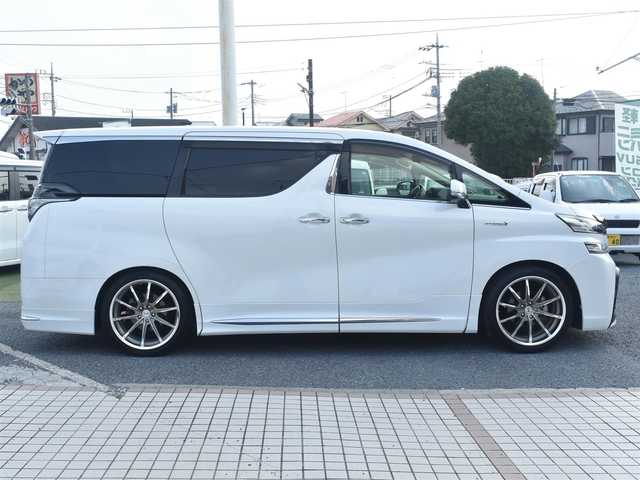 トヨタ ヴェルファイア ハイブリット X 神奈川県 2015(平27)年 5.2万km ホワイトパールクリスタルシャイン ワンオーナー/社外メモリナビ/フルセグテレビ/両側パワースライドドア/モデリスタエアロ/社外２０インチAW/社外足廻り/ETC/LEDヘッドライト/保証書/スペアスマートキー