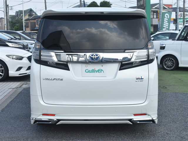 トヨタ ヴェルファイア ハイブリット X 神奈川県 2015(平27)年 5.2万km ホワイトパールクリスタルシャイン ワンオーナー/社外メモリナビ/フルセグテレビ/両側パワースライドドア/モデリスタエアロ/社外２０インチAW/社外足廻り/ETC/LEDヘッドライト/保証書/スペアスマートキー