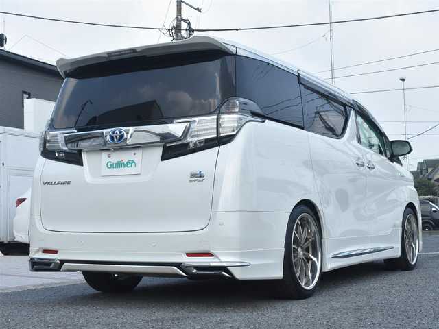 トヨタ ヴェルファイア ハイブリット X 神奈川県 2015(平27)年 5.2万km ホワイトパールクリスタルシャイン ワンオーナー/社外メモリナビ/フルセグテレビ/両側パワースライドドア/モデリスタエアロ/社外２０インチAW/社外足廻り/ETC/LEDヘッドライト/保証書/スペアスマートキー