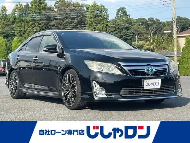 トヨタ カムリ ハイブリット Gパッケージ 埼玉県 2013(平25)年 11万km アティチュードブラックマイカ (株)IDOMが運営する【じしゃロン鳩ヶ谷店】の自社ローン専用車両になりますこちらは現金またはオートローンご利用時の価格です。自社ローンご希望の方は別途その旨お申付け下さい/社外HDDナビ/フルセグテレビ/バックカメラ/クルーズコントロール/プッシュスタート/ETC/純正HID/前後ドライブレコーダー/社外19インチAW/革巻ステアリング/運転席パワーシート