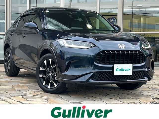 ホンダ ＺＲ－Ｖ ハイブリッド e:HEV Z 静岡県 2023(令5)年 0.4万km ミッドナイトブルービームM 純正ナビ/AM/FM/Bluetooth/フルセグ/USB/Apple carplay/Andoroid Auto/主要装備/・純正ナビ　/・ＢＯＳＥスピーカー　/・レーダークルーズコントロール　/・パドルシフト　/・ＥＴＣ２．０　/・ドライブレコーダー　/・全方位カメラ　/・シートメモリー　/・コーナーセンサー　/・シートヒーター　/・オートハイビーム　/・ＳＯＳコール/・ワイヤレス充電/・純正アルミホイール/・レーンキープ/・衝突軽減システム/・アイドリングストップ/・オートホールド/・電動リアゲート/・横滑り防止装置/・プラズマクラスター/・ワンオーナー