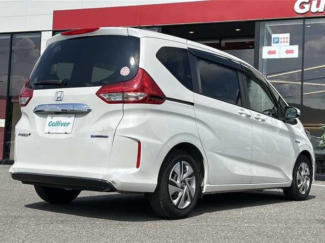 ホンダ フリード＋ ハイブリット G ホンダセンシング 大阪府 2021(令3)年 3.6万km プラチナホワイトパール ワンオーナー　ホンダセンシング　社外８型ナビ　ＣＤ　ＤＶＤ　ＢＴ　ＵＳＢ　ＨＤＭＩ　フルセグＴＶ　バックカメラ　両側パワースライドドア　レーダークルコン　ワイパーデアイサー　木目調パネル　ウィンカーミラー　ＥＴＣ