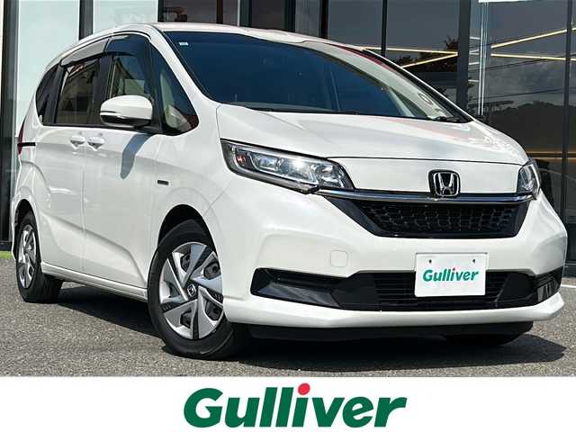 ホンダ フリード＋ ハイブリット G ホンダセンシング 大阪府 2021(令3)年 3.6万km プラチナホワイトパール ワンオーナー　ホンダセンシング　社外８型ナビ　ＣＤ　ＤＶＤ　ＢＴ　ＵＳＢ　ＨＤＭＩ　フルセグＴＶ　バックカメラ　両側パワースライドドア　レーダークルコン　ワイパーデアイサー　木目調パネル　ウィンカーミラー　ＥＴＣ