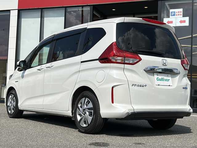 ホンダ フリード＋ ハイブリット G ホンダセンシング 大阪府 2021(令3)年 3.6万km プラチナホワイトパール ワンオーナー　ホンダセンシング　社外８型ナビ　ＣＤ　ＤＶＤ　ＢＴ　ＵＳＢ　ＨＤＭＩ　フルセグＴＶ　バックカメラ　両側パワースライドドア　レーダークルコン　ワイパーデアイサー　木目調パネル　ウィンカーミラー　ＥＴＣ