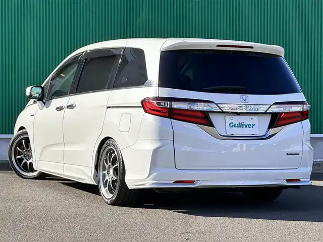 ホンダ オデッセイ ハイブリッド アブソルートセンシングEXパック 宮城県 2016(平28)年 13.1万km ホワイトオーキッドパール Hondaインターナビ＋リンクアップフリー＋ETC車載器（ナビ連動）/マルチビューカメラシステム＋スマートパーキングアシストシステ/＝＝＝/ホンダセンシング/●衝突軽減ブレーキ 〈CMBS〉/●歩行者事故低減ステアリング/●ACC 〈アダプティブ・クルーズ・コントロール〉/●LKAS 〈車線維持支援システム〉/●路外逸脱抑制機能/●誤発進抑制機能/●先行車発進お知らせ機能/●標識認識機能/ブラインドスポットインフォメーション/純正フリップダウンモニター/Hondaインターナビ/【CD/DVD/HDMI/SD/USB/IPOD】/AC100V/1500W/両側パワースライドドア/ハーフレザーシート/運転席パワーシート/WORK18インチアルミホイール/TEIN車高調/TEIN EDFC ACTIVE PRO/LEDヘッドライト/LEDフォグランプ/サンシェード/ステアリングスイッチ/ドアバイザー/純正フロアマット/保証書/取扱説明書/スペアキー/TVキット/純正サスペンション積込