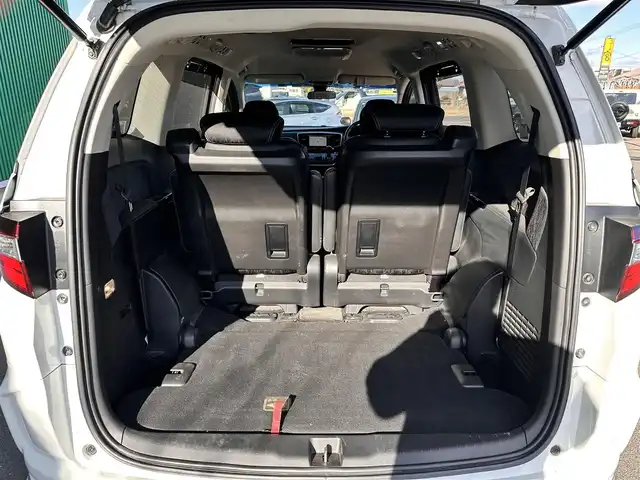 ホンダ オデッセイ ハイブリッド アブソルートセンシングEXパック 宮城県 2016(平28)年 13.1万km ホワイトオーキッドパール Hondaインターナビ＋リンクアップフリー＋ETC車載器（ナビ連動）/マルチビューカメラシステム＋スマートパーキングアシストシステ/＝＝＝/ホンダセンシング/●衝突軽減ブレーキ 〈CMBS〉/●歩行者事故低減ステアリング/●ACC 〈アダプティブ・クルーズ・コントロール〉/●LKAS 〈車線維持支援システム〉/●路外逸脱抑制機能/●誤発進抑制機能/●先行車発進お知らせ機能/●標識認識機能/ブラインドスポットインフォメーション/純正フリップダウンモニター/Hondaインターナビ/【CD/DVD/HDMI/SD/USB/IPOD】/AC100V/1500W/両側パワースライドドア/ハーフレザーシート/運転席パワーシート/WORK18インチアルミホイール/TEIN車高調/TEIN EDFC ACTIVE PRO/LEDヘッドライト/LEDフォグランプ/サンシェード/ステアリングスイッチ/ドアバイザー/純正フロアマット/保証書/取扱説明書/スペアキー/TVキット/純正サスペンション積込