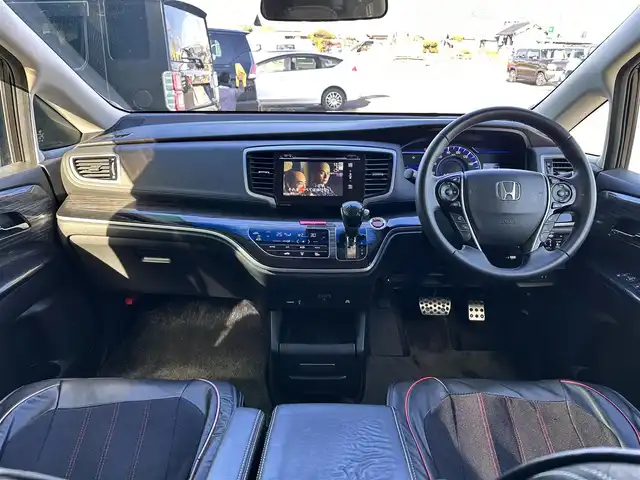 ホンダ オデッセイ ハイブリッド アブソルートセンシングEXパック 宮城県 2016(平28)年 13.1万km ホワイトオーキッドパール Hondaインターナビ＋リンクアップフリー＋ETC車載器（ナビ連動）/マルチビューカメラシステム＋スマートパーキングアシストシステ/＝＝＝/ホンダセンシング/●衝突軽減ブレーキ 〈CMBS〉/●歩行者事故低減ステアリング/●ACC 〈アダプティブ・クルーズ・コントロール〉/●LKAS 〈車線維持支援システム〉/●路外逸脱抑制機能/●誤発進抑制機能/●先行車発進お知らせ機能/●標識認識機能/ブラインドスポットインフォメーション/純正フリップダウンモニター/Hondaインターナビ/【CD/DVD/HDMI/SD/USB/IPOD】/AC100V/1500W/両側パワースライドドア/ハーフレザーシート/運転席パワーシート/WORK18インチアルミホイール/TEIN車高調/TEIN EDFC ACTIVE PRO/LEDヘッドライト/LEDフォグランプ/サンシェード/ステアリングスイッチ/ドアバイザー/純正フロアマット/保証書/取扱説明書/スペアキー/TVキット/純正サスペンション積込