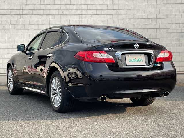 日産 シーマ ハイブリッド VIP G 山口県 2014(平26)年 4.5万km ガーネットブラック サンルーフ/BOSEサウンド/後席プライベートシアターシステム/電動サンシェード/純正ナビ/(TV/CD/DVD/BT/FM/AM)/バックカメラ/レーダークルーズコントロール/レーンキープアシスト/横滑り防止機能/プッシュスタート/スマートキー/オートライト/キセノンヘッドライト/フォグランプ/本革シート/全席パワーシート/全席シートヒーター/全席エアシート/助手席オットマン/革巻ステアリング/ステアリングリモコン/電動格納ミラー/純正18インチアルミホイール/純正フロアマット/ETC