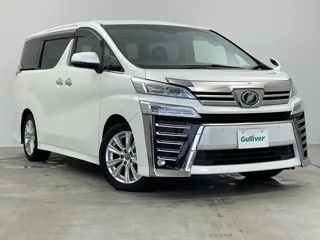 トヨタ ヴェルファイア Z Aエディション 新潟県 2019(令1)年 8万km ホワイトパールクリスタルシャイン 純正ディラーOP10インチナビ/Bluetooth/フルセグTV/純正12インチフリップダウンモニター/バックモニター/デジタルインナーミラー/ETC/トヨタセーフティセンス/ブラインドスポットモニター/パーキングアシスト/追従型クルーズコントロール/両側パワースライドドア/LEDヘッドライト/オートライト/オートハイビーム/純正18インチホイール/スペアキー