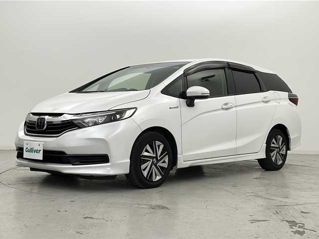 ホンダ シャトル ハイブリッド ホンダセンシング 宮城県 2020(令2)年 7.7万km プラチナホワイトパール 禁煙車/ホンダセンシング/・路外逸脱抑制機能/・衝突軽減ブレーキ/・オートクルーズコントロール/社外7インチナビ/・BT.CD.DVD.USB.SD.AUX/バックカメラ/社外ETC/プッシュスタート/スマートキー/スペアー（1本）/ステアリングスイッチ/ドアバイザー/アイドリングストップ/横滑り防止機能/ヘッドライトレベライザー