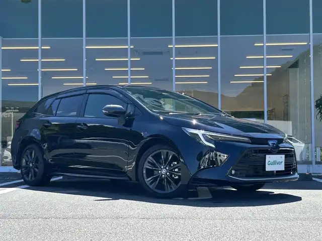 トヨタ カローラツーリング ハイブリッド ダブルバイビー 愛媛県 2022(令4)年 1.5万km アティチュードブラックマイカ 純正8インチディスプレイオーディオ/・Bluetooth/フルセグTV　/バックカメラ　/ビルトインETC/ハーフレザー/トヨタセーフティセンス/衝突軽減ブレーキ　/コーナーセンサー　/レーンキープ/オートライト/オートマチックハイビーム/BSM/PKSB　/RCTA/LEDヘッドライト　/純正17インチAW/スペアキー