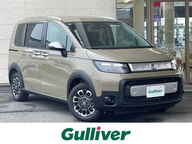 ホンダ フリード クロスター 兵庫県 2025(令7)年 0.1万km未満 ベージュ 登録済未使用車/両側パワースライドドア/衝突軽減ブレーキ/コーナーセンサー/ブラインドスポットモニター/ハーフレザーシート/前席シートヒーター/電動パーキングブレーキ/オートホールド/ステアリングリモコン/革巻きステアリング/スマートキー/スペアキー/純正アルミ15インチ
