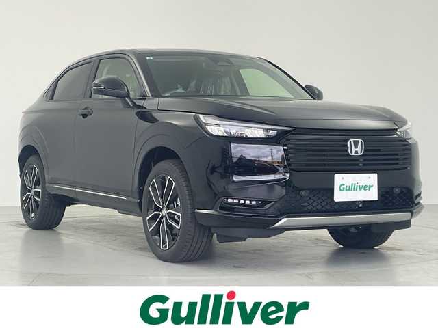 ホンダ ヴェゼル ハイブリッド e:HEV Z 愛知県 2025(令7)年 0.1千km クリスタルブラックパール 登録済未使用車/純正ナビ/・フルセグ/・Bluetooth/アダプティブクルーズコントロール/シートヒーター/電動リアゲート/バックカメラ/衝突軽減ブレーキ/誤発進抑制（前方・後方）/ブラインドスポットモニター/クリアランスソナー/レーンキープアシスト/ワイヤレス充電/ビルドインETC2.0/パドルシフト/純正アルミホイール