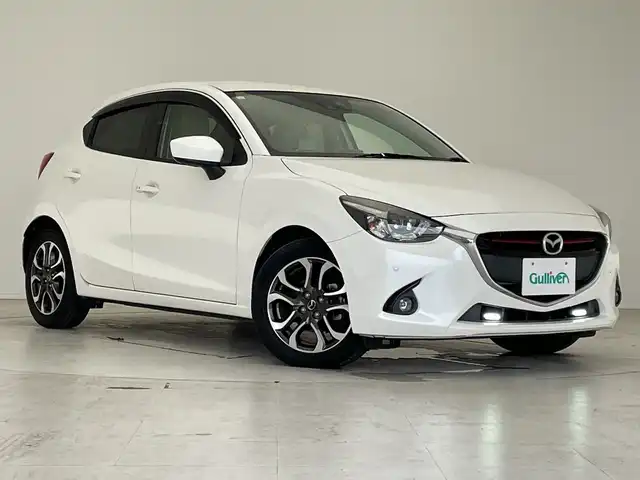 マツダ デミオ XD ツーリング Lパッケージ 愛知県 2015(平27)年 5.5万km スノーフレイクホワイトパールマイカ ・純正７インチナビ/＜フルセグTV＞ /・バックカメラ/・クルーズコントロール/・パドルシフト/・ETC/・HUD/・BSM/・i-stop/・横滑り防止装置/・衝突被害軽減システム/・ABS/・ステアリングスイッチ/・スマートキー/・プッシュスタート/・ハーフレザーシート/・SRSエアバッグ（運転席/助手席/サイド）/・LEDヘッドランプ