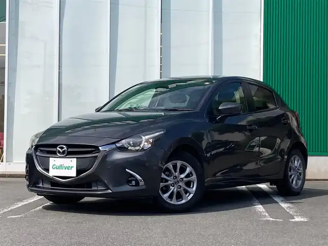 マツダ デミオ 13S 静岡県 2016(平28)年 5.6万km マシーングレープレミアムM エンジンスタートストップ/パワーステアリング/パワーウィンドウ/アイドリングストップ/スマートキー/オートエアコン/ETC/USB入力端子/バックカメラ/純正ナビ（CD.DVD.BT.ワンセグ）/純正フロアマット/純正アルミホイール/D席N席シートヒーター/ABS/横滑り防止装置/オートライト/LEDライト/W+サイドエアバック/衝突軽減システム