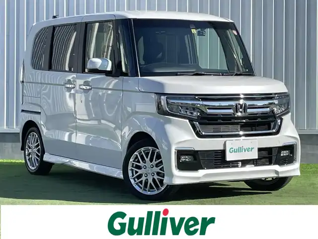 ホンダ Ｎ ＢＯＸ カスタム L ターボ 香川県 2023(令5)年 3.4万km プラチナホワイトパール 登録時走行距離：33181km/ディーラー純正ナビ/　CD DVD BT フルセグTV/バックカメラ/ホンダセンシング/レーダークルーズコントロール/レーンキープアシスト/クリアランスソナー/LEDヘッドライト/オートライト/フォグランプ/レベライザヘッドライト/ホールド機能付き電子パーキングブレーキ/ハーフレザーシート/シートヒーター/ロールサンシェード/ISOFIX/前後ドライブレコーダー/ビルトインETC/プッシュスタート/スマートキー/スペアキー/新車時保証書/ワンオーナー