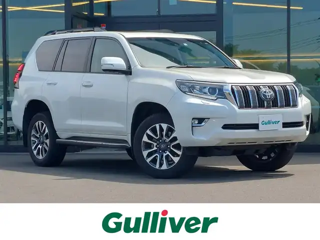 トヨタ ランドクルーザー プラド TX Lパッケージ 東京都 2023(令5)年 1.6万km ホワイトパールクリスタルシャイン サンルーフ/ワンオーナー/Toyota Safety Sense/・プリクラッシュセーフティ/・レーンディパーチャーアラート/・オートマチックハイビーム/・レーダークルーズコントロール/・クリアランスソナー/・ブラインドスポットモニター/パノラミックビューモニター/ルームミラー型ドライブレコーダー(前後)/プッシュスタート/MTモード付きAT/純正ナビ/フルセグTV/ETC/ルーフレール/レザーシート/パワーシート/シートヒーター/ベンチレーション/LEDヘッドライト/19インチ純正アルミホイール