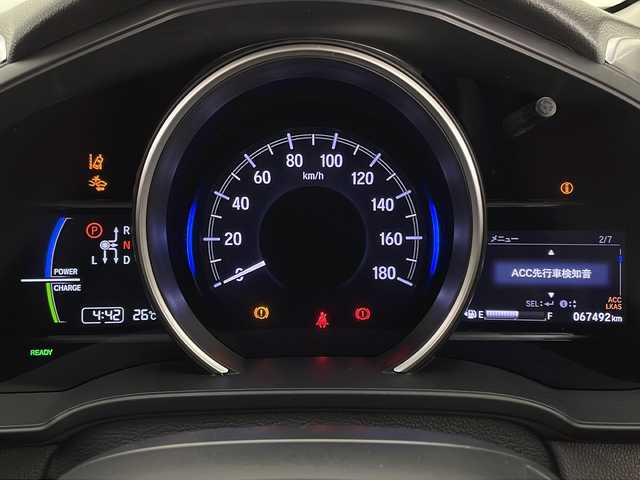 ホンダ フィット ハイブリット F 宮崎県 2018(平30)年 6.8万km プレミアムホワイトパールⅡ 禁煙車/ホンダセンシング/社外ナビTV/（AVIC-RZ201/CD/FMAM/Bluetooth/ワンセグTV)/社外バックカメラ/純正ビルトインETC/純正ルーフエンドスポイラー/純正フロアマット/アダプティブクルーズコントロール/レーンディパーチャーアラート/ウインカードアミラー/リアプライバシーガラス/オートエアコン/ハーフシェイドガラス/スマートキー/プッシュエンジンスタート/新車時保証書/取扱い説明書