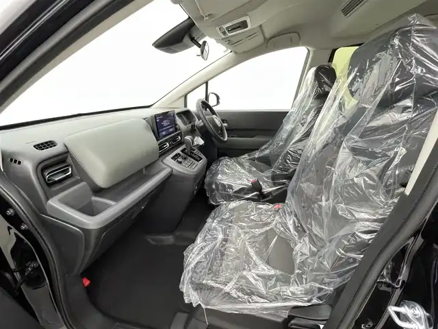 ホンダ フリード ハイブリット e:HEV クロスター 熊本県 2025(令7)年 0.1千km クリスタルブラックパール 登録済未使用車/純正9インチナビLXM-242ZFNI（ＡｐｐｌＣａｒＰｌａｙ・ＡｎｄｒｏｉｄＡｕｔｏ・ＢＴ・フルセグ）/バックカメラ　/両側パワースライドドア　/前後クリアランスソナー　/ホンダセンシング/・衝突軽減ブレーキ/・歩行者事故低減ステアリング/・路外逸脱制御機能/・アダブティブクルーズコントロール/・車線維持支援システム/・先行車発進お知らせ機能/・標識認識機能/・オートマチックハイビーム/・ブラインドスポットモニター/横滑り防止/前席シートヒーター/オートブレーキホールド/ハーフレザーシート/純正１５インチAW/ルーフレール/オートライト/LEDヘッドライト/フォグライト/スマートキー/プッシュスタート/スペアキー1本/保証書/取扱説明書