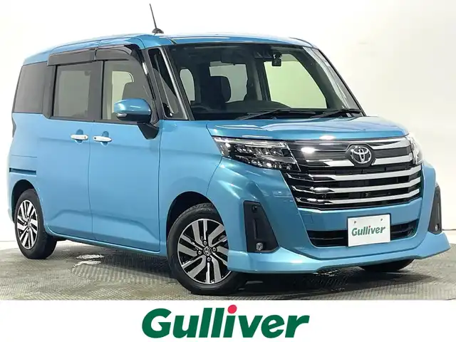 トヨタ ルーミー カスタムG 大阪府 2023(令5)年 1.3万km ターコイズブルーマイカメタリック 純正9incナビ(フルセグ/DVD再生/Bluetooth) 360カメラ 後席モニター ETC 両側パワースライドドア シートヒーター 衝突軽減 レーダークルコン クリアランスソナー ドラレコ