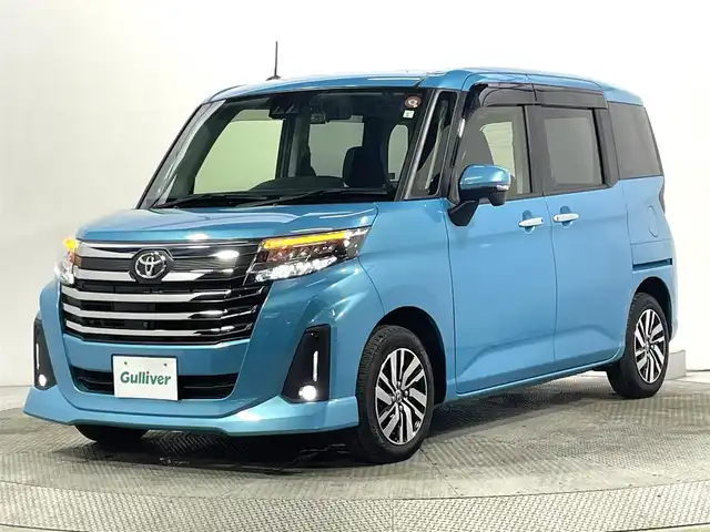 トヨタ ルーミー カスタムG 大阪府 2023(令5)年 1.3万km ターコイズブルーマイカメタリック 純正9incナビ(フルセグ/DVD再生/Bluetooth) 360カメラ 後席モニター ETC 両側パワースライドドア シートヒーター 衝突軽減 レーダークルコン クリアランスソナー ドラレコ
