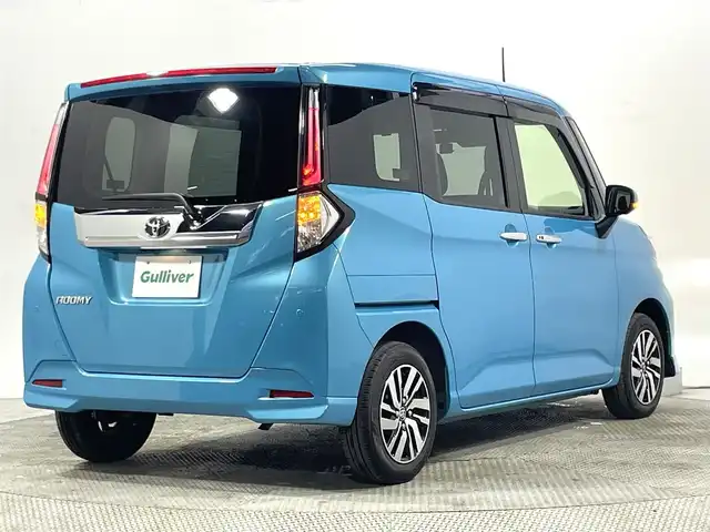 トヨタ ルーミー カスタムG 大阪府 2023(令5)年 1.3万km ターコイズブルーマイカメタリック 純正9incナビ(フルセグ/DVD再生/Bluetooth) 360カメラ 後席モニター ETC 両側パワースライドドア シートヒーター 衝突軽減 レーダークルコン クリアランスソナー ドラレコ