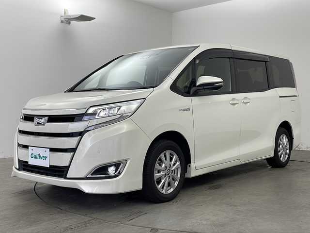 トヨタ ノア ハイブリッド G 兵庫県 2020(令2)年 0.6万km ラグジュアリーホワイトパールクリスタルシャインガラスフレーク ・純正10インチナビ＆TV＆BT＆DVD＆SD/・バックカメラ/・両側パワースライドドア/・トヨタセーフティセンス/・プリクラッシュセーフティ/・レーンディパーチャーアラート/・クルーズコントロール/・クリアランスソナー/・オートマチックハイビーム/・スマートキー/・プッシュスタート/・ビルトインETC/・前後ドライブレコーダー/・前席シートヒーター/・リアヒーター/・LEDライト/・フォグ/・オートライト/・フロアマット