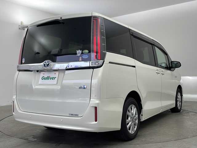 トヨタ ノア ハイブリッド G 兵庫県 2020(令2)年 0.6万km ラグジュアリーホワイトパールクリスタルシャインガラスフレーク ・純正10インチナビ＆TV＆BT＆DVD＆SD/・バックカメラ/・両側パワースライドドア/・トヨタセーフティセンス/・プリクラッシュセーフティ/・レーンディパーチャーアラート/・クルーズコントロール/・クリアランスソナー/・オートマチックハイビーム/・スマートキー/・プッシュスタート/・ビルトインETC/・前後ドライブレコーダー/・前席シートヒーター/・リアヒーター/・LEDライト/・フォグ/・オートライト/・フロアマット