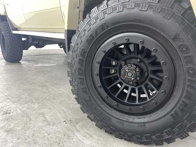 トヨタ ランドクルーザー 福島県 2015(平27)年 0.7万km ベージュ ５ＭＴ/パートタイム４ＷＤ/社外16inアルミホイール/マッドタイヤ（GEOLANDAR）/デジタルインナーミラー/バックカメラ（ミラー）/フロントバンパーガード　/荷台ロールバー/フェンダーミラー　/ＥＴＣ　/保証書/・取扱説明書