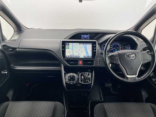 トヨタ ヴォクシー ハイブリッド ZS 煌 愛知県 2018(平30)年 5.1万km ホワイトパールクリスタルシャイン モデリスタエアロ/純正10型ナビ/フリップダウンモニター/両側パワースライドドア/クルーズコントロール/シートヒーター/バックカメラ/純正アルミホイール/LEDヘッドライト/リアオートエアコン/オートマチックハイビーム/ETC/衝突軽減システム/フルセグ/CD DVD/Bluetooth/ステアリングスイッチ/スマートキー/プッシュスタート