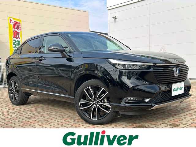 ホンダ ヴェゼル ハイブリッド e:HEV Z 鳥取県 2021(令3)年 7.1万km クリスタルブラックパール ワンオーナー/スマートキーx2個/ハーフレザーシート/パワーテールゲート/プリクラッシュセーフティ/ブラインドスポットモニタリング/アダクティブクルーズ/レーンデパーチャー/クリアランスソナー/ドライブレコーダー/ダウンヒルアシスト/ギャザーズインターナビ/フルセグ・Bluetooth/バックカメラ/ハンドルヒーター/前席シートヒーター/オートエアコン/オートワイパー/オートライト/オートリトラクトミラー/LEDヘッドライト/USB入力/ETCユニット/保証書・取説