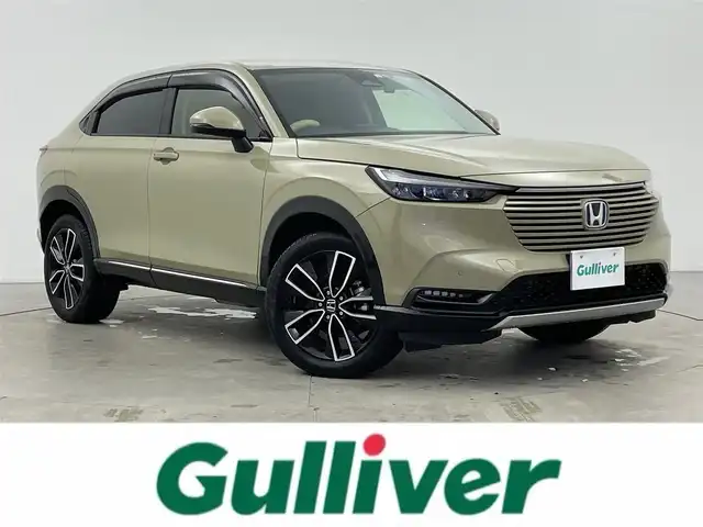 ホンダ ヴェゼル ハイブリッド e:HEV Z 富山県 2023(令5)年 2.9万km サンドカーキパール ワンオーナー/寒冷地仕様/社外9型ナビ【MDV-M909HDF】/(AM/FM/CD/DVD?SD/USB/BT/HDMI)/フルセグTV/バックカメラ/衝突被害軽減ブレーキ/レーンキープアシスト/アダプティブクルーズコントロール/ブラインドスポットモニター/クリアランスソナー/アダプティブハイビーム/LEDヘッドライト/電動リアゲート/ハーフレザーシート/前席シートヒーター/ETC/ドライブレコーダー前後/ステアリングヒーター/ステアリングカバー/スマートキー×２/プッシュスタート/純正18インチAW/ドアバイザー/取扱説明書/保証書