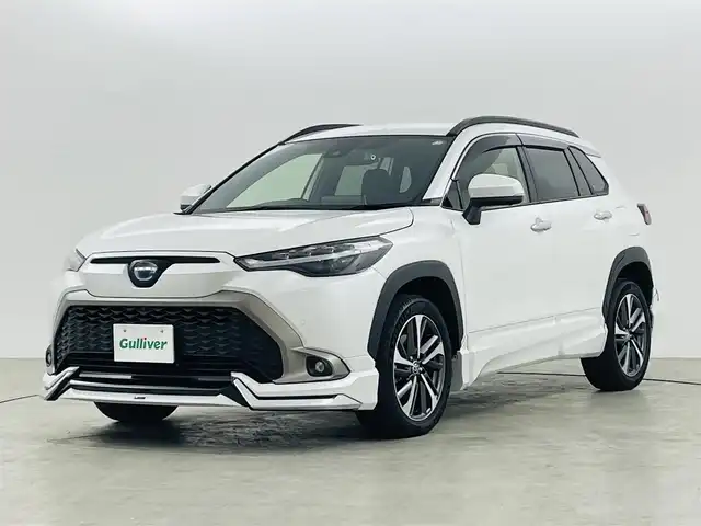 トヨタ カローラ クロス ハイブリッド Z 福島県 2023(令5)年 1.7万km プラチナホワイトパールマイカ ワンオーナー/純正ディスプレイオーディオナビ付き　/トヨタセーフティーセンス　/・PCS/・LTA/・BSM/・クリアランスソナー/・PKSB/・RSA/・ACC/前後ドライブレコーダー　/モデリスタエアロ　/ＥＴＣ　/パワーバックドア　/電子パーキング　/・ブレーキホールド　/ハーフレザーシート/・シートヒーター/・パワーシート/ルーフレール　/プッシュスタート/・スマートキー/・スペアキー/LEDライト/・オートライト/・フォグライト/純正フロアマット/・ドアバイザー/取扱説明書/・保証書