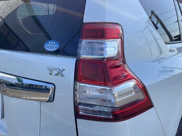 トヨタ ランドクルーザー プラド TX Lパッケージ 新潟県 2015(平27)年 5.2万km ホワイトパールクリスタルシャイン ワンオーナー/エンジンスターター/冬タイヤ積載/純正SDナビ/（DTV/DVD/Bluetooth）/フロントカメラ/サイドカメラ/バックカメラ/４WD/センターデフロック/クルーズコントロール/コーナーセンサー/ビルドインETC/ドライブレコーダー/自動防眩ミラー/ベージュレザーシート/前席シートヒーター/前席電動シート/オートライト/フォグランプ/ウィンカーミラー/ドアバイザー/スペアキー×１