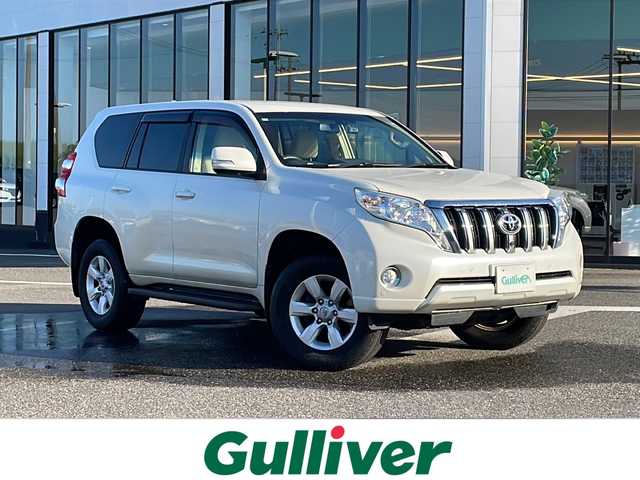 トヨタ ランドクルーザー プラド TX Lパッケージ 新潟県 2015(平27)年 5.2万km ホワイトパールクリスタルシャイン ワンオーナー/エンジンスターター/冬タイヤ積載/純正SDナビ/（DTV/DVD/Bluetooth）/フロントカメラ/サイドカメラ/バックカメラ/４WD/センターデフロック/クルーズコントロール/コーナーセンサー/ビルドインETC/ドライブレコーダー/自動防眩ミラー/ベージュレザーシート/前席シートヒーター/前席電動シート/オートライト/フォグランプ/ウィンカーミラー/ドアバイザー/スペアキー×１
