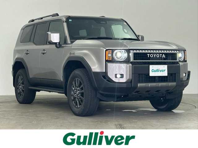 トヨタ ランドクルーザー ２５０ VX 千葉県 2025(令7)年 0.1万km アバンギャルドブロンズメタリック サンルーフ/丸目ヘッドライト/セーフティセンス（衝突回避支援パッケージ）/・プリクラッシュセーフティ/・レーンディパーチャーアラート/・オートマチックハイビーム/・ドライバー異常時対応システム/・プロアクティブドライビングアシスト/・発進遅れ告知機能/・レーンレーシングアシスト/・レーダークルーズコントロール/・ロードサインアシスト/12.3インチディスプレイオーディオ/・コネクティッドナビ対応/・AM/FMチューナー/・USB入力/・Apple CarPlay/Android Auto/・ETC2.0/・地デジTV/・HDMI入力/・パイオニア プレミアムサウンドシステム/デジタルインナーミラー/ステアリングヒーター/ブラインドスポットモニター/LEDヘッドライト/純正18インチAW/運転席パワーシート/コーナーセンサー/ビルトインETC2.0